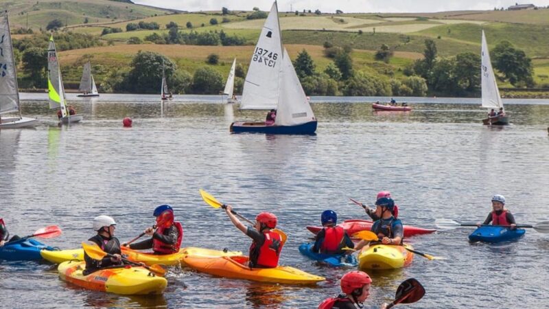A group of people kayaking on a lake