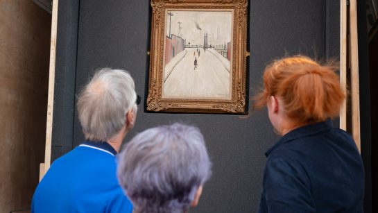 Arcon Housing residents view a Lowry painting in the back of a van that has been converted by Touchstones to take artwork out into local communities